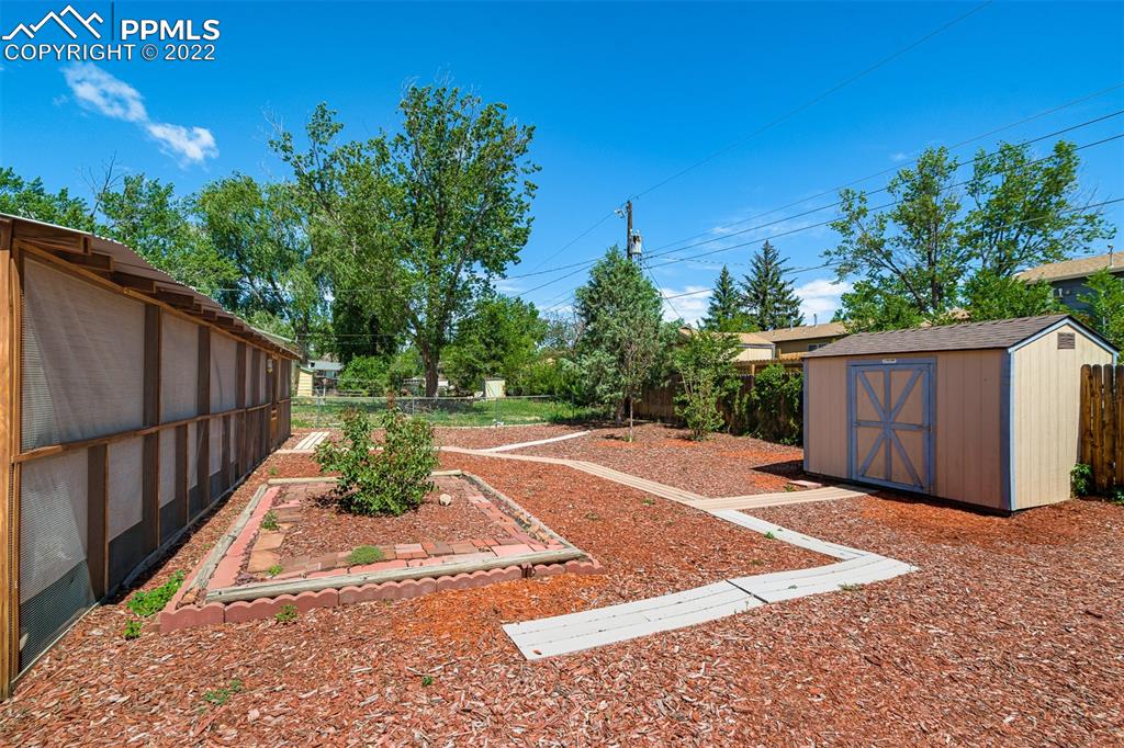 2515 Monterey Road Colorado Springs, CO 80910 - Photo 6 of 32 a view of a backyard with wooden fence