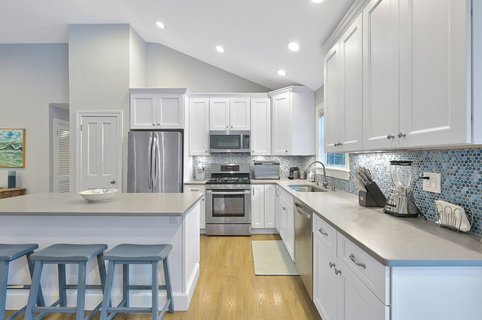25 Nidzyn Avenue Remsenburg, NY 11960 - Photo 11 of 32 a kitchen with kitchen island granite countertop a sink cabinets and stainless steel appliances