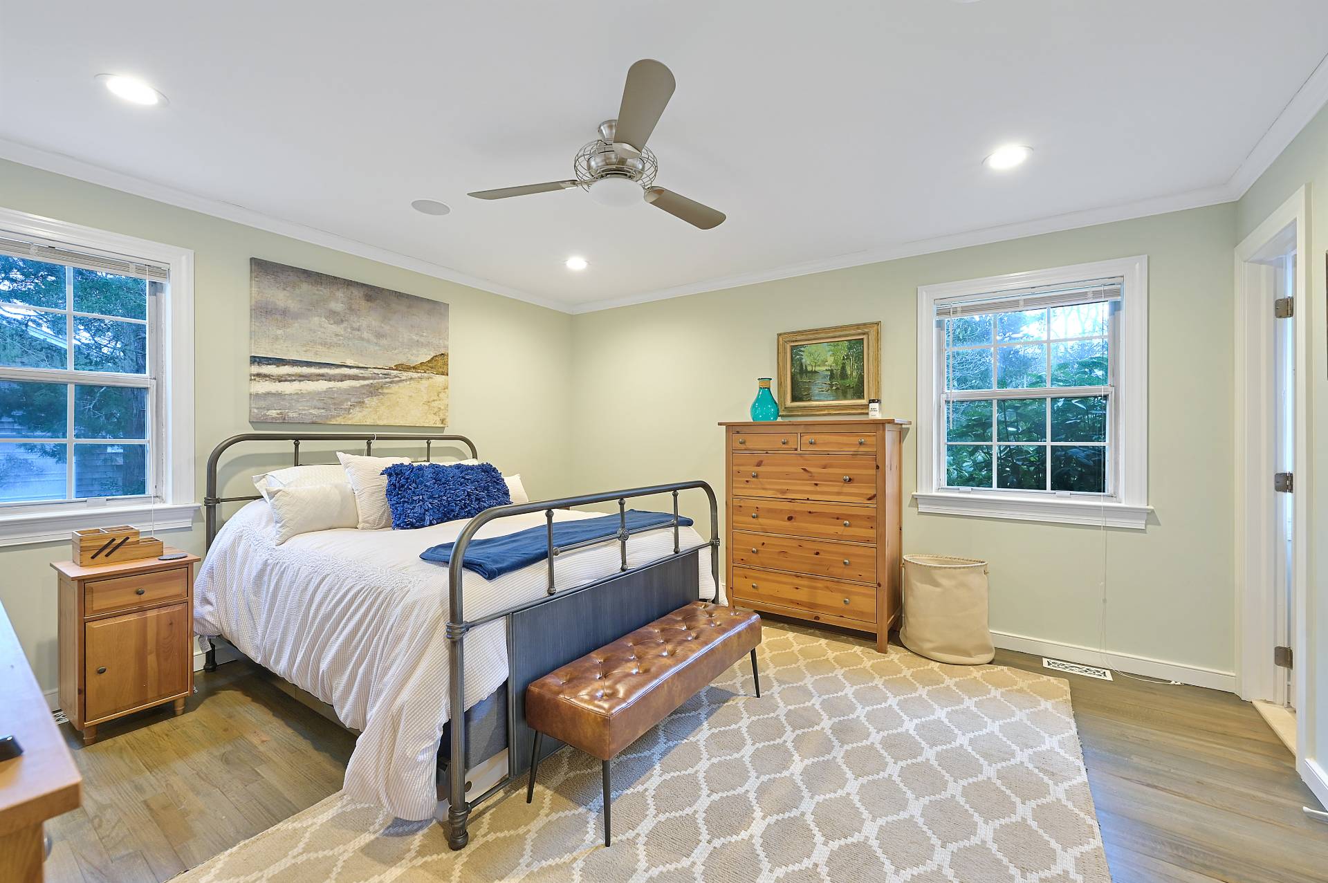 25 Nidzyn Avenue Remsenburg, NY 11960 - Photo 13 of 32 a bedroom with a bed and wooden floor