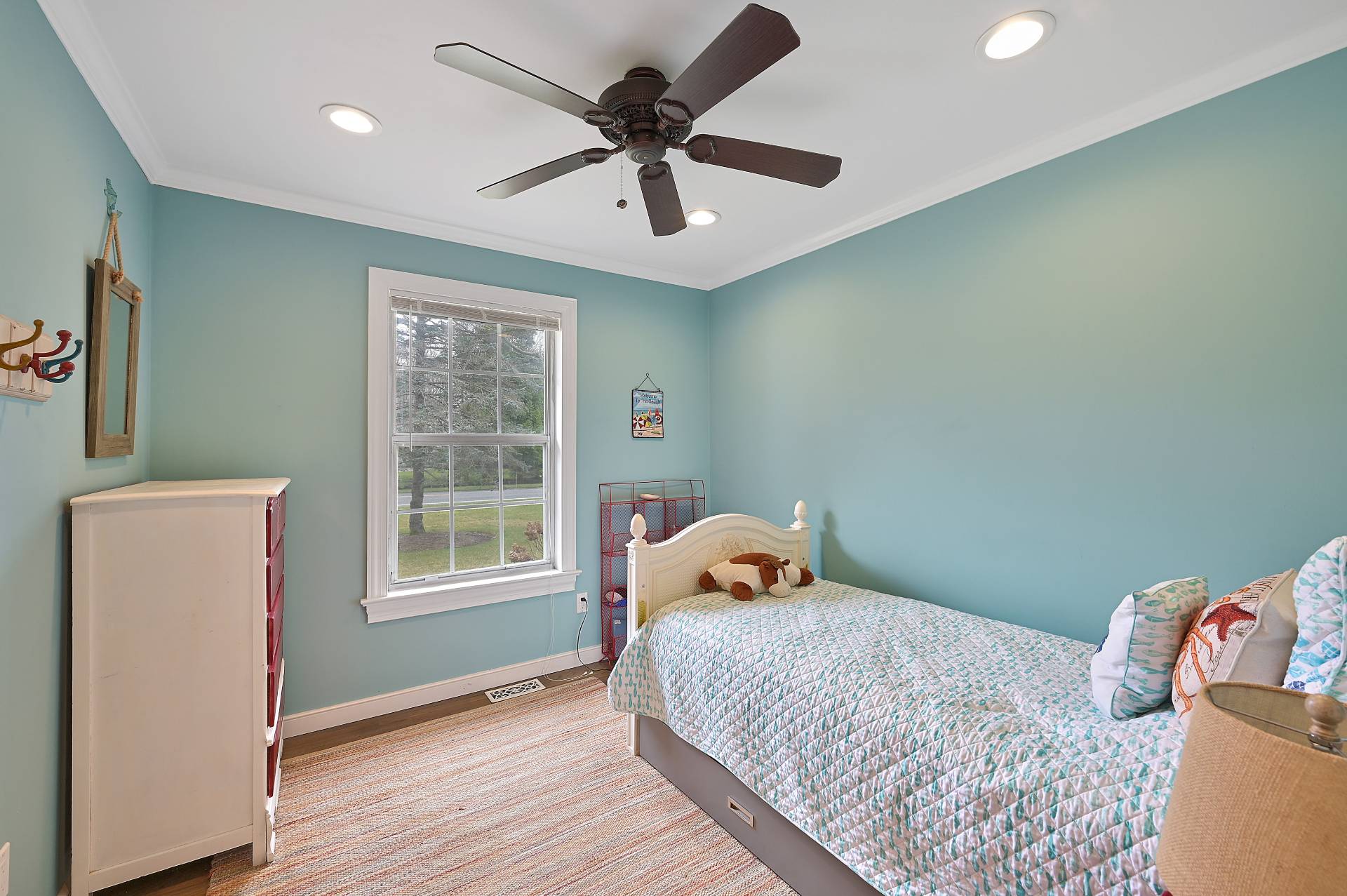 25 Nidzyn Avenue Remsenburg, NY 11960 - Photo 15 of 32 a bedroom with a bed and a window