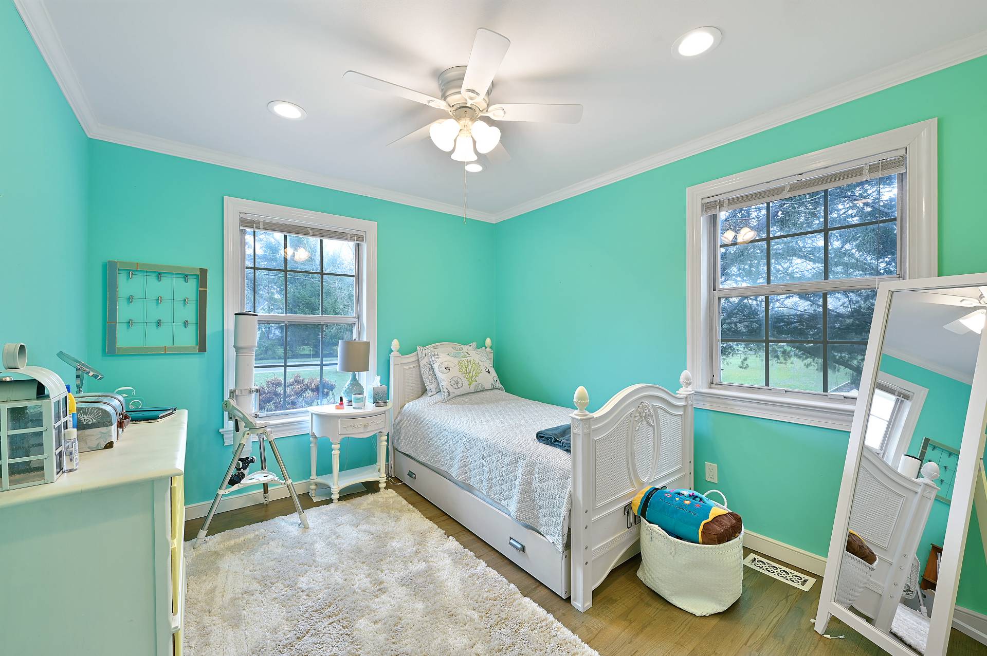 25 Nidzyn Avenue Remsenburg, NY 11960 - Photo 17 of 32 a bedroom with a bed and a window
