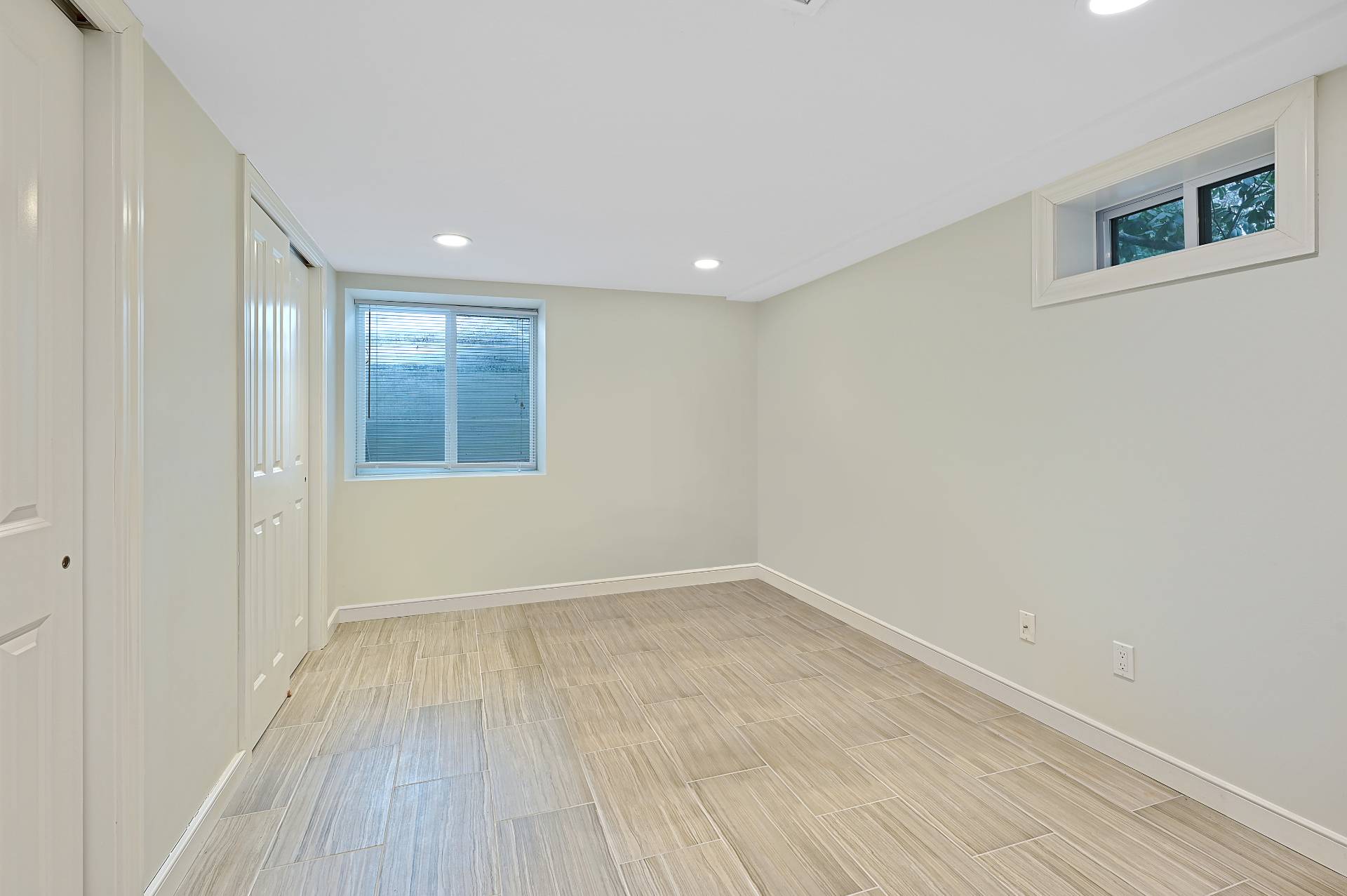25 Nidzyn Avenue Remsenburg, NY 11960 - Photo 22 of 32 a view of an empty room with wooden floor and a window