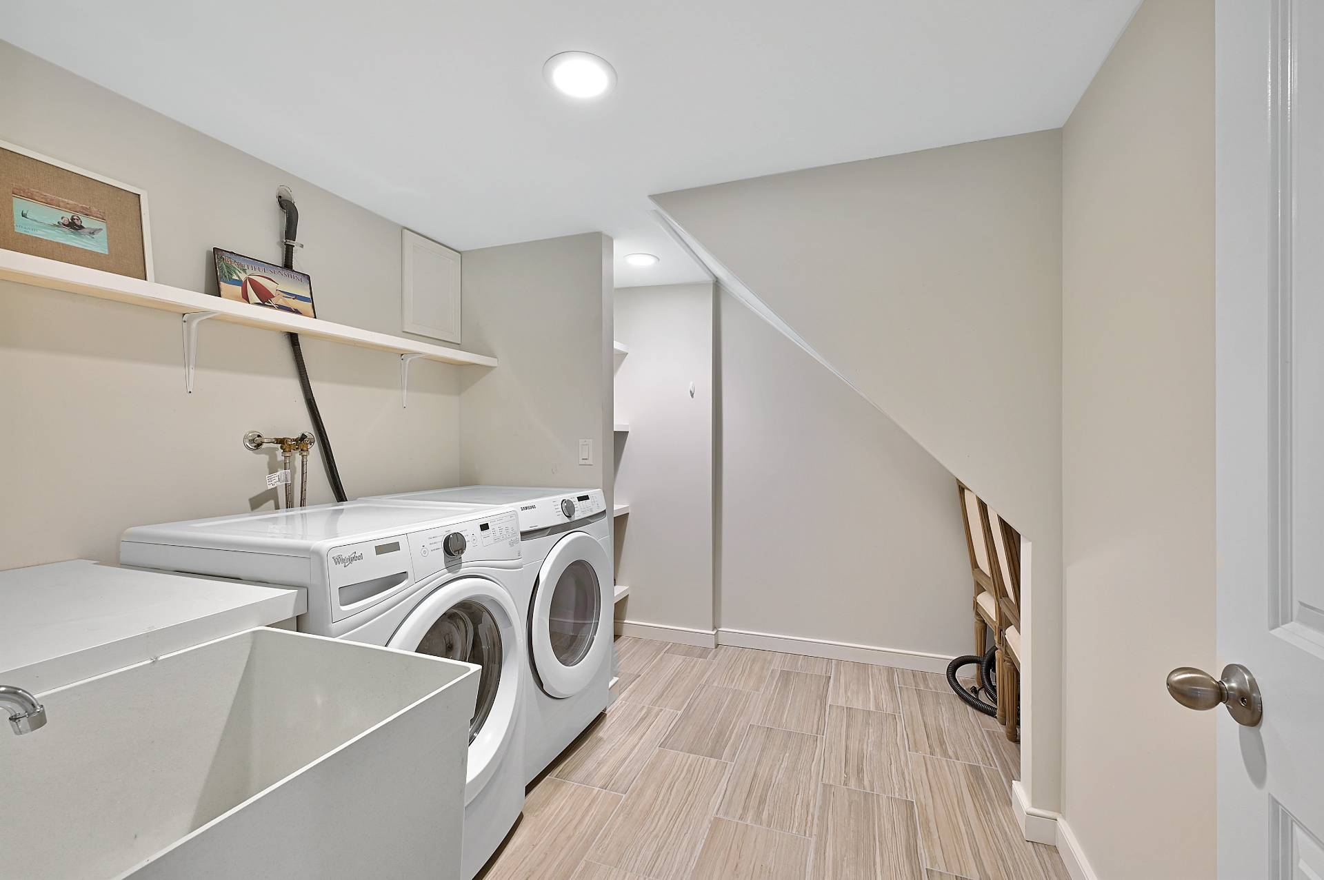 25 Nidzyn Avenue Remsenburg, NY 11960 - Photo 24 of 32 a view of washer and dryer with kitchen in the background
