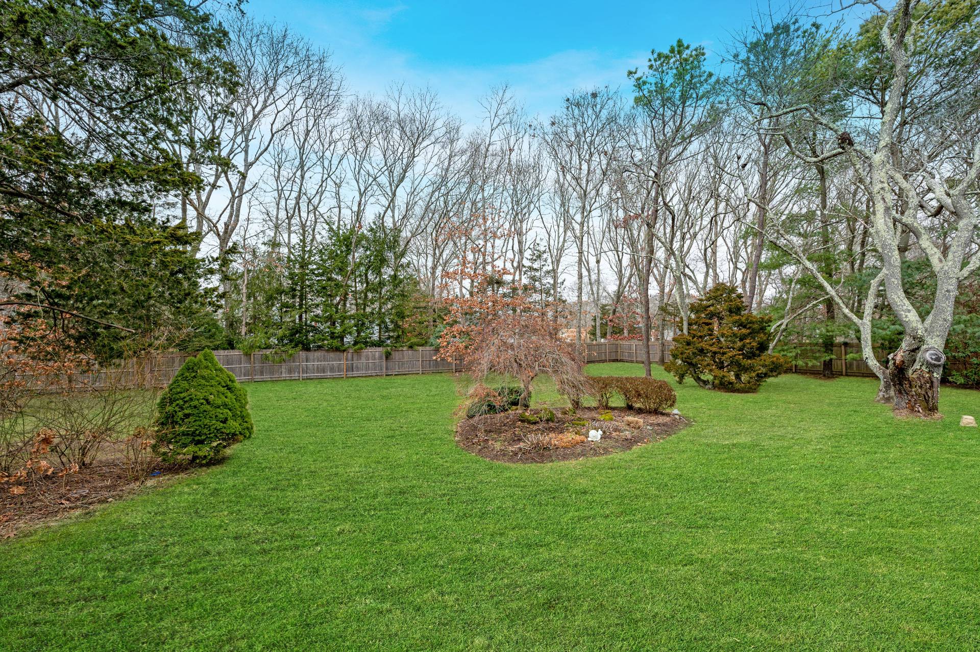 25 Nidzyn Avenue Remsenburg, NY 11960 - Photo 28 of 32 a big yard with lots of green space and trees