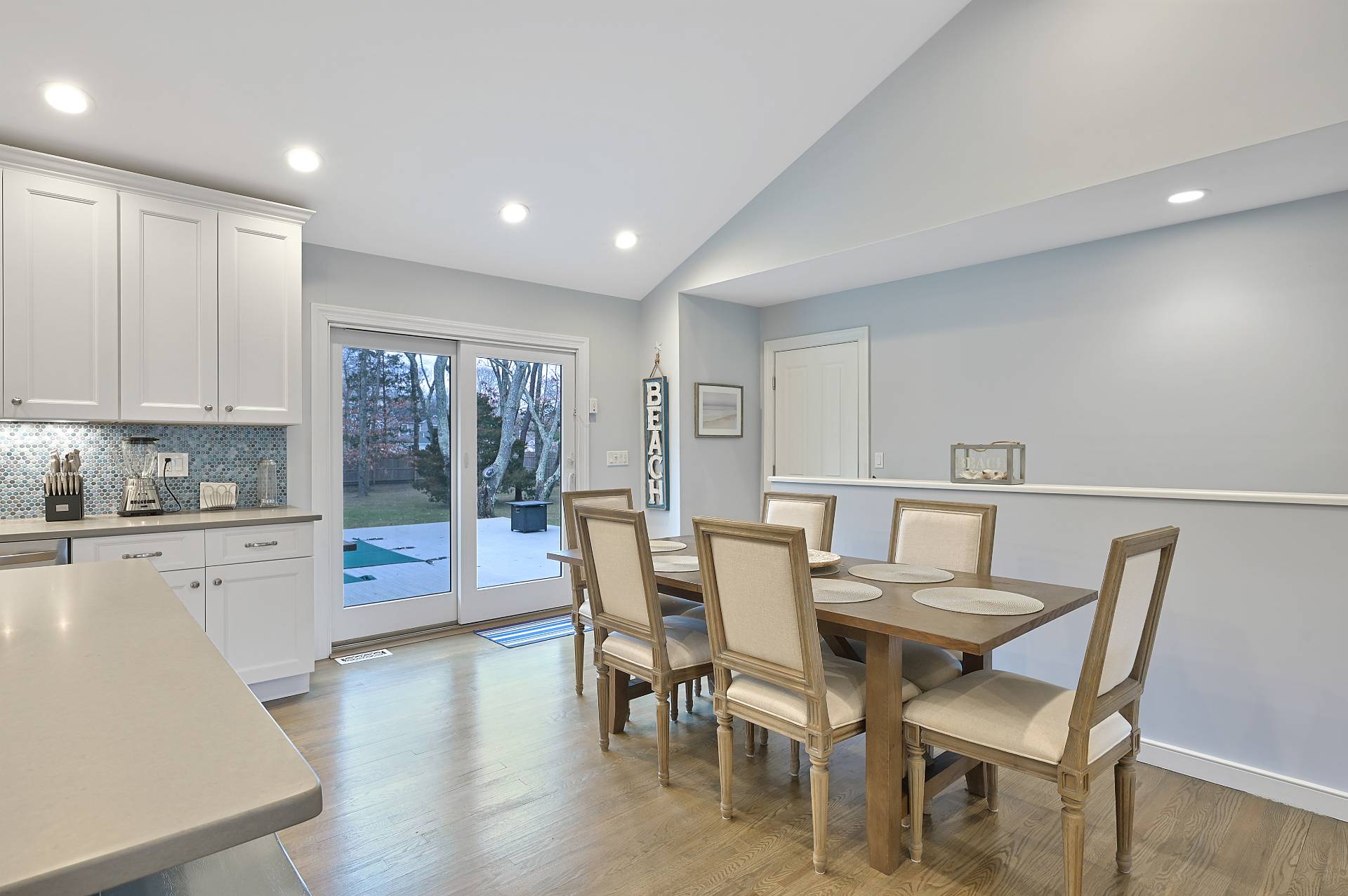 25 Nidzyn Avenue Remsenburg, NY 11960 - Photo 7 of 32 a view of a dining room with furniture and wooden floor