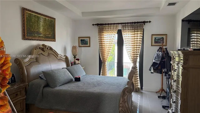 a bed room with a bed and a window