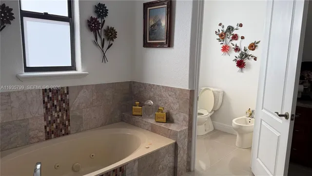 a bathroom with a toilet and a sink