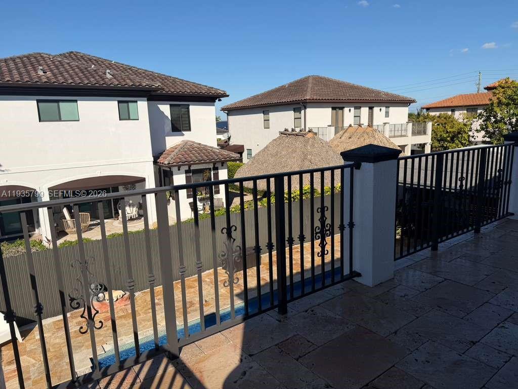 14431 Southwest 22nd Terrace Miami, FL 33175 - Photo 16 of 17 a front view of a house with a porch