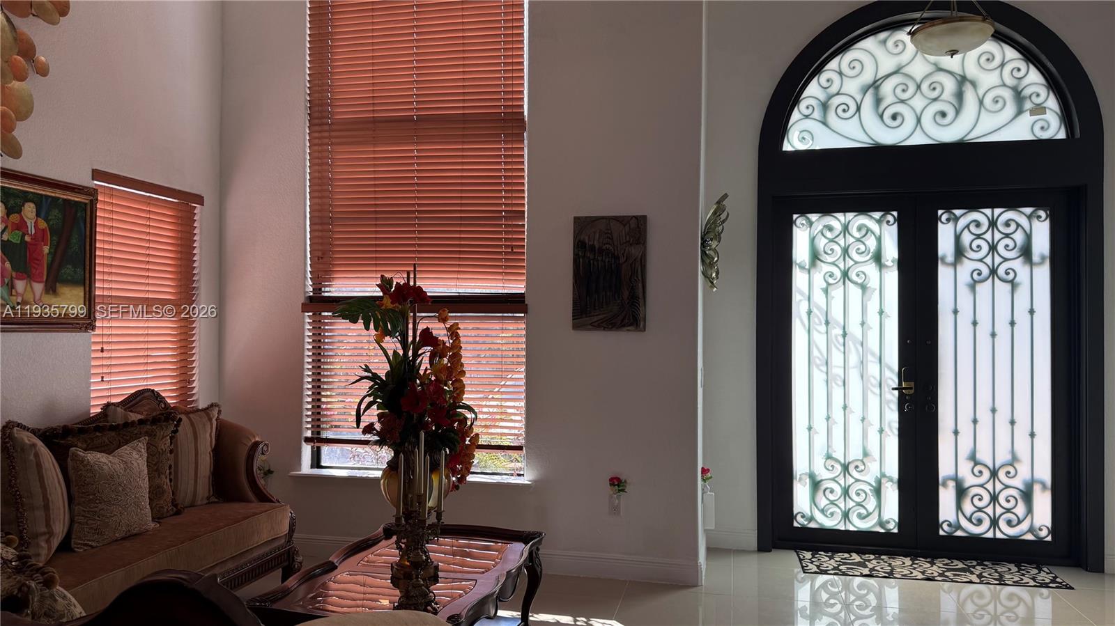 14431 Southwest 22nd Terrace Miami, FL 33175 - Photo 2 of 17 a living room with furniture and a window