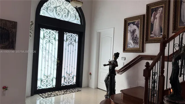 a view of front door with stairs