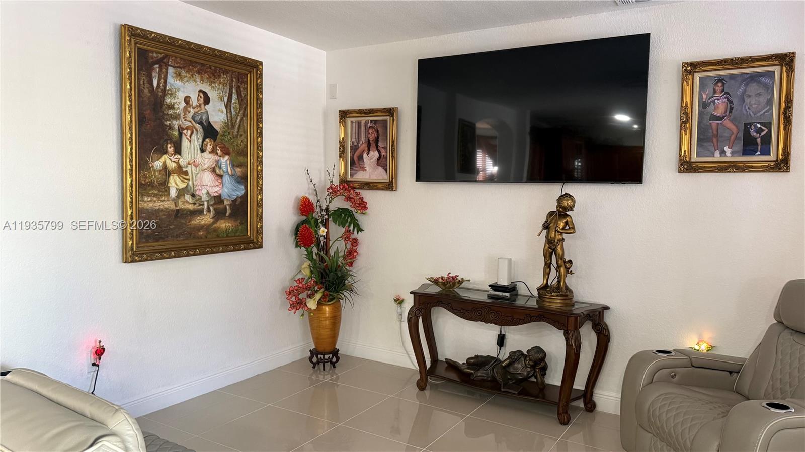 14431 Southwest 22nd Terrace Miami, FL 33175 - Photo 5 of 17 a living room with furniture and flowers