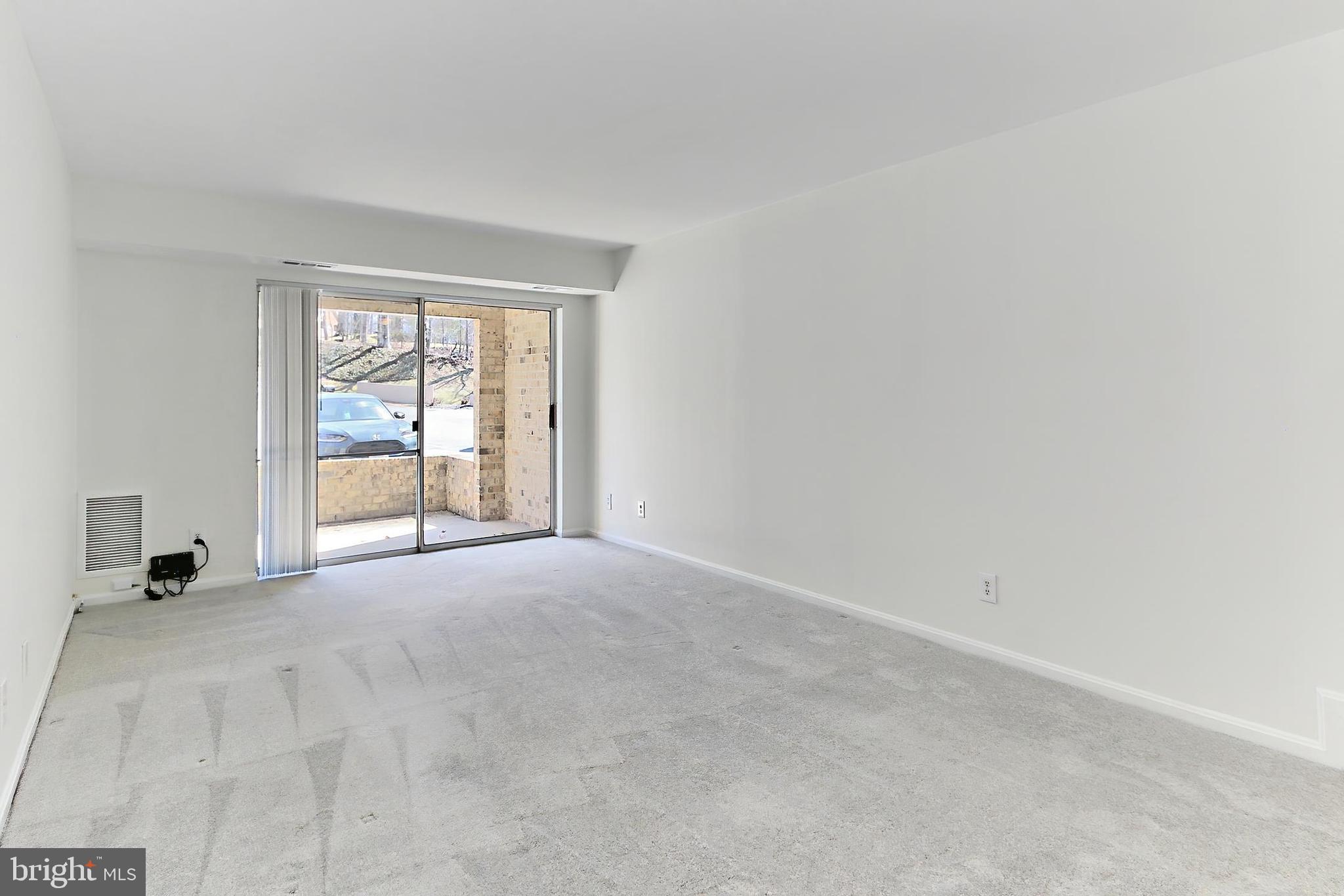 5912 Cove Landing Road, Unit 204 Burke, VA 22015 - Photo 11 of 42 an empty room with windows