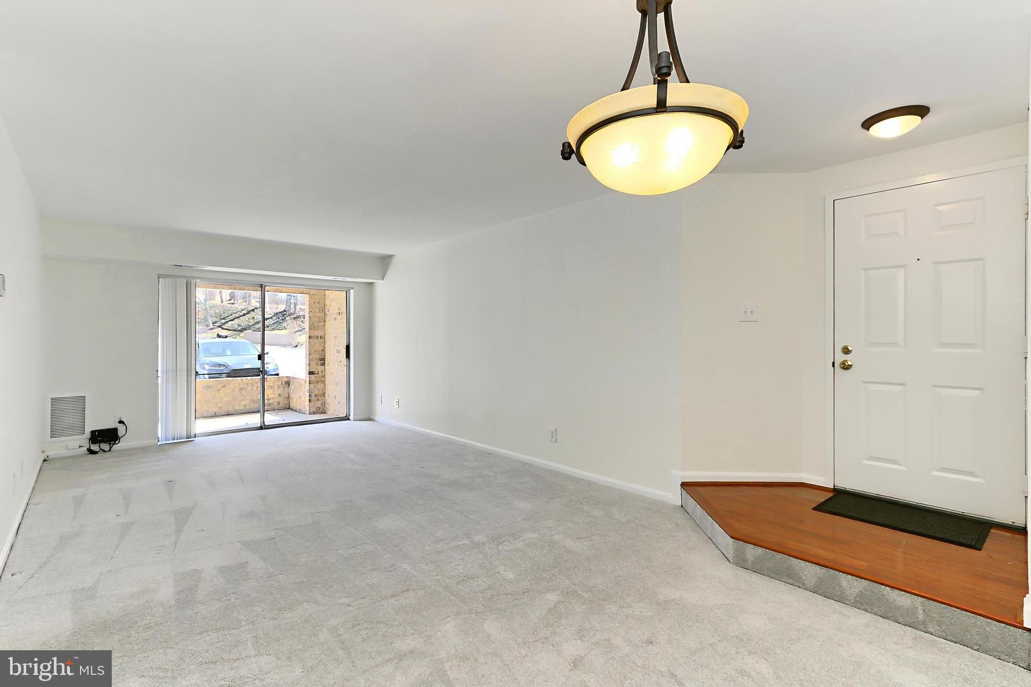 5912 Cove Landing Road, Unit 204 Burke, VA 22015 - Photo 15 of 42 a view of a room with window and chandelier