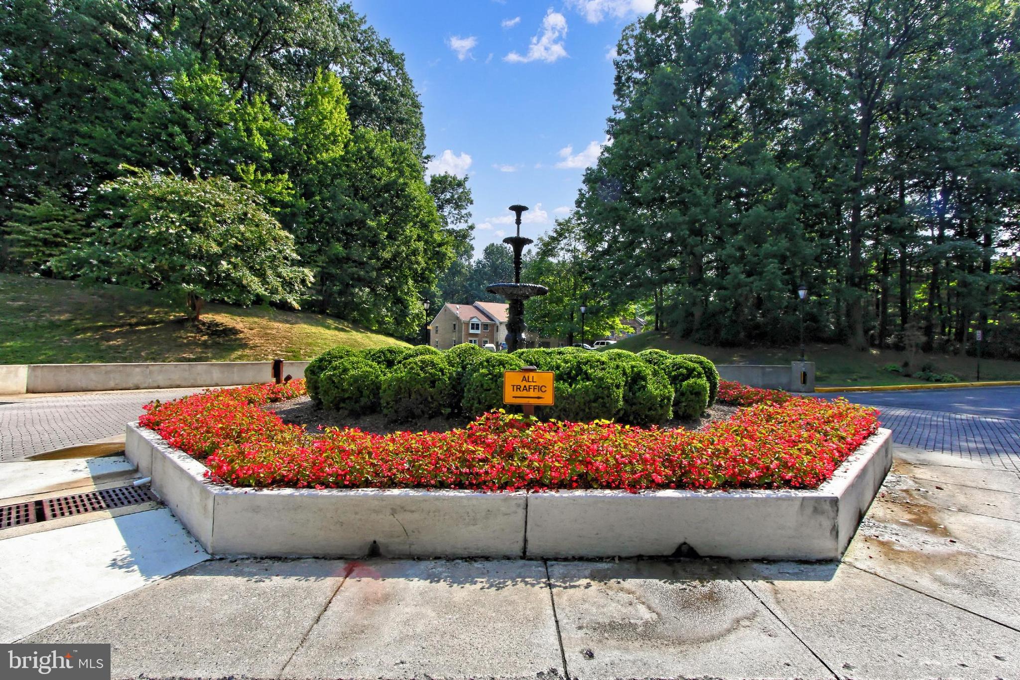 5912 Cove Landing Road, Unit 204 Burke, VA 22015 - Photo 2 of 42 a wooden bench sitting in a backyard