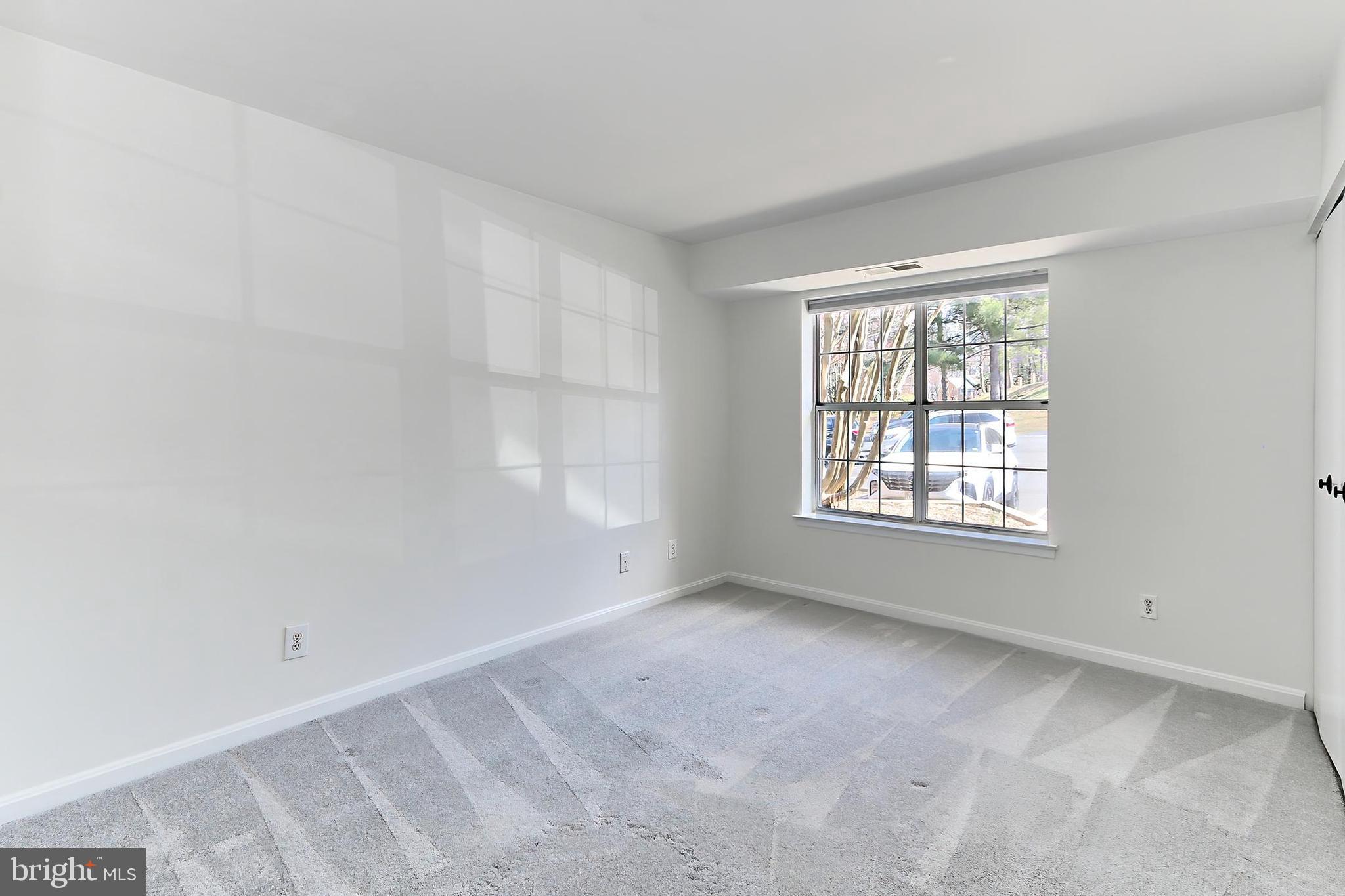 5912 Cove Landing Road, Unit 204 Burke, VA 22015 - Photo 22 of 42 a view of an empty room with a window