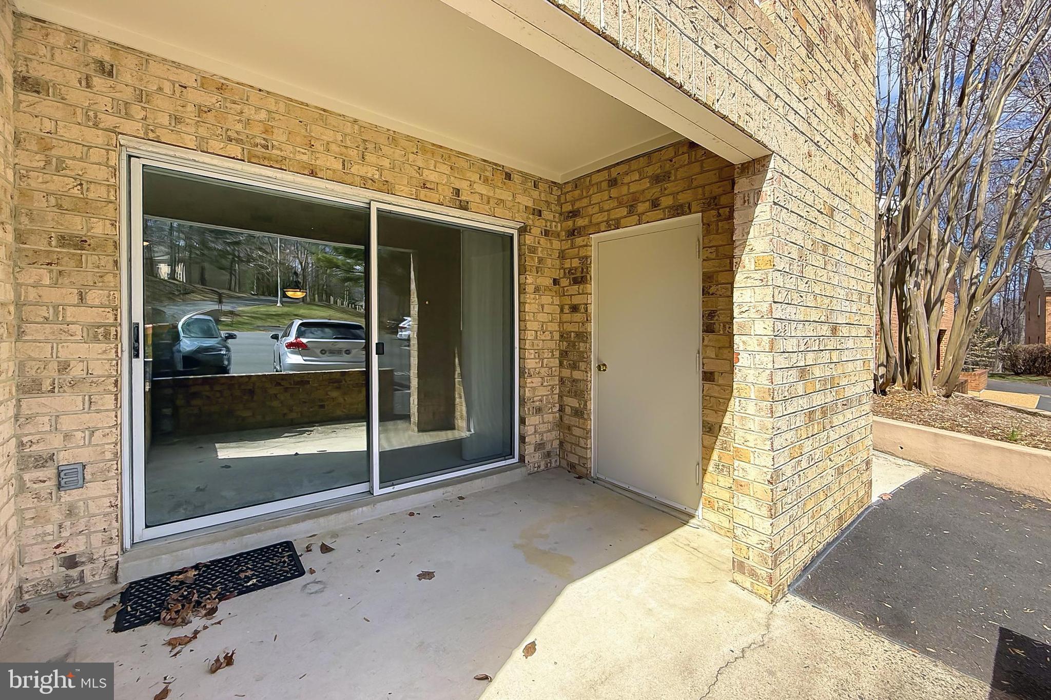 5912 Cove Landing Road, Unit 204 Burke, VA 22015 - Photo 30 of 42 a view of a brick house with a large window