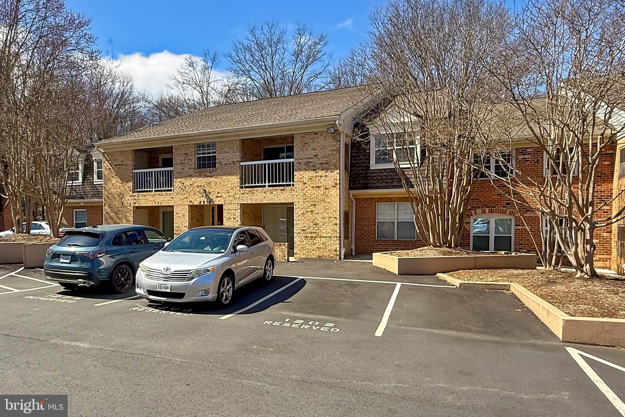 5912 Cove Landing Road, Unit 204 Burke, VA 22015 - Photo 5 of 42 a car parked in front of a house