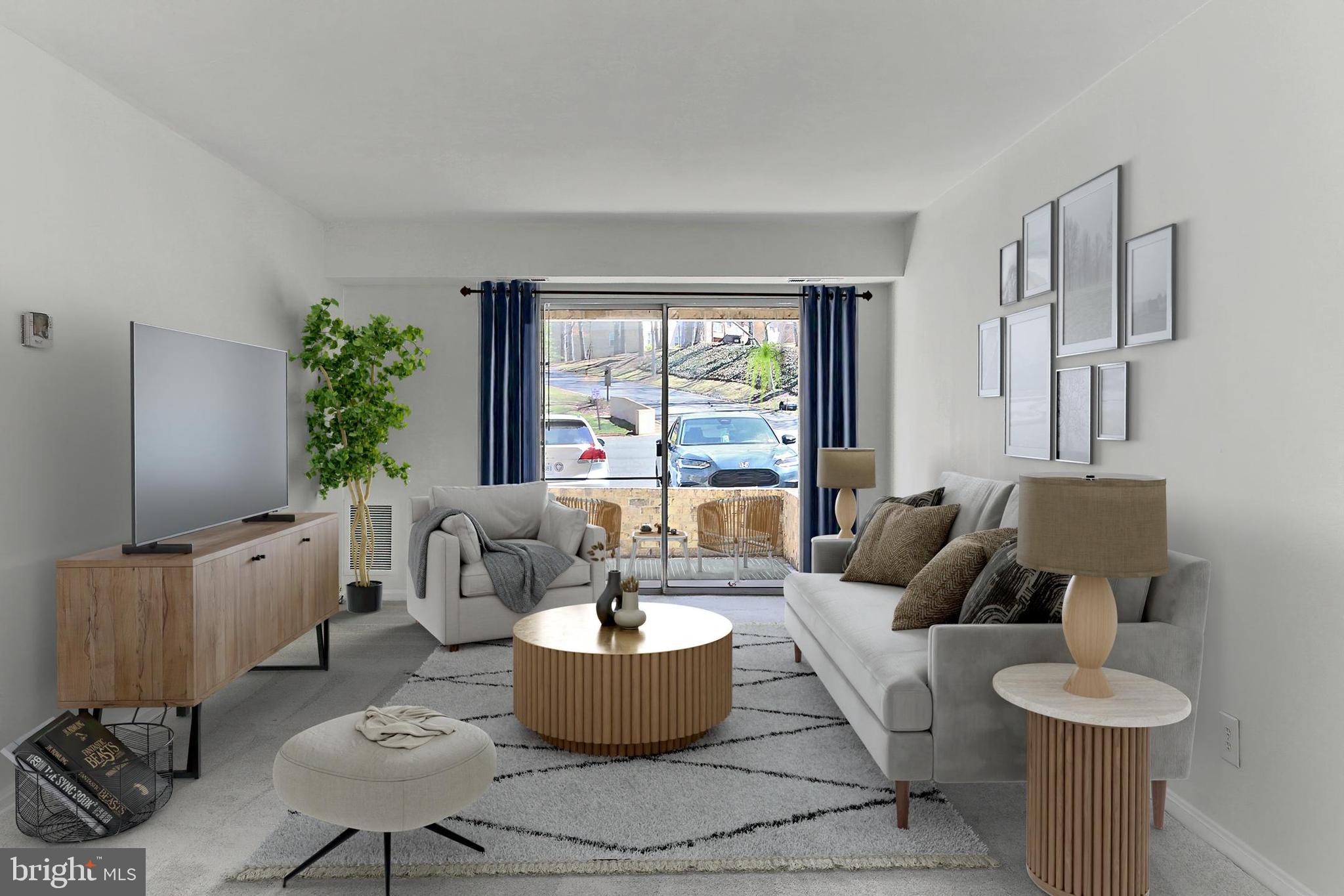 5912 Cove Landing Road, Unit 204 Burke, VA 22015 - Photo 10 of 42 a living room with furniture and a large window