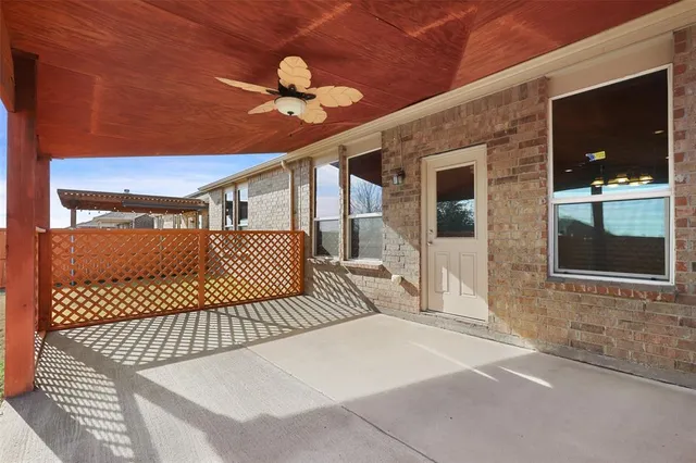 a bedroom with a bed and a lamp on the dresser