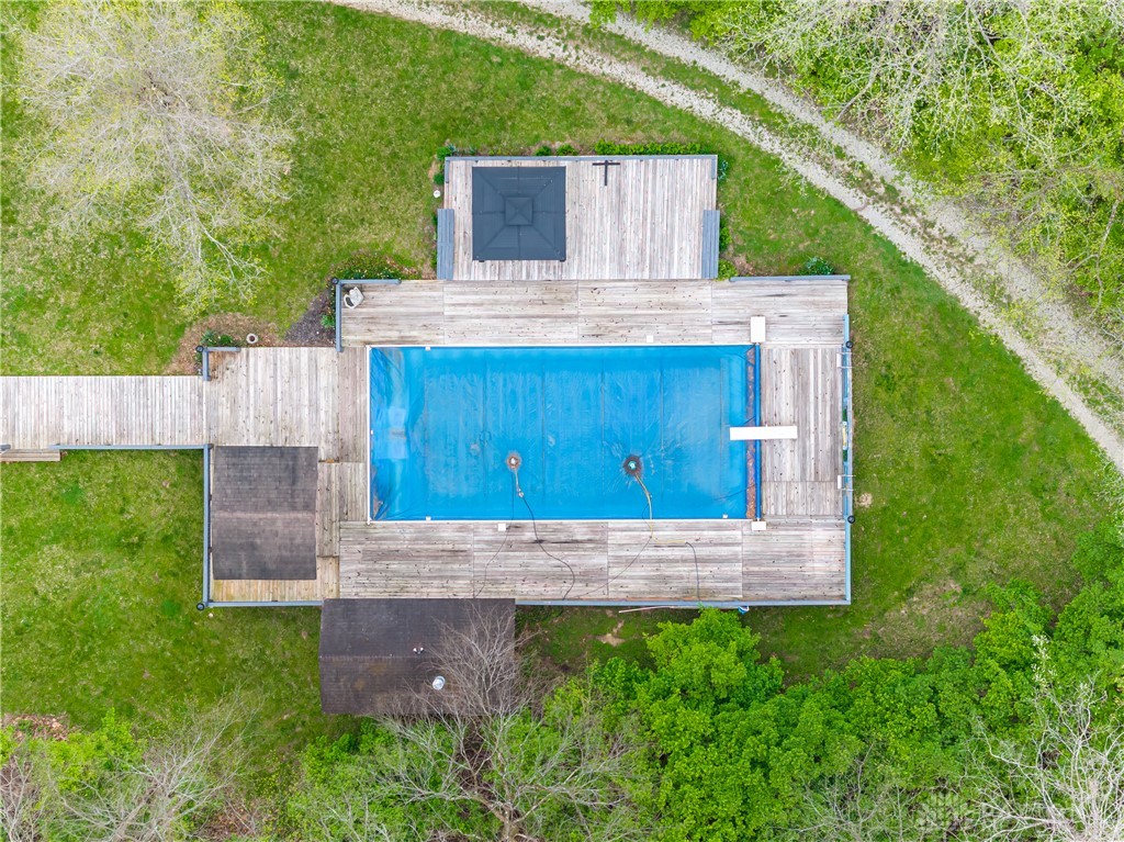 6750 Little Twin Road Germantown, OH 45327 - Photo 78 of 88 This aerial view showcases an inviting pool area surrounded by lush greenery, perfect for outdoor enjoyment.