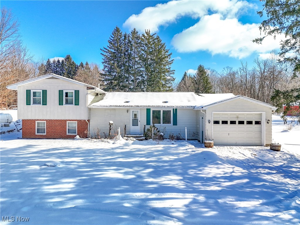 Tri-level home featuring a garage