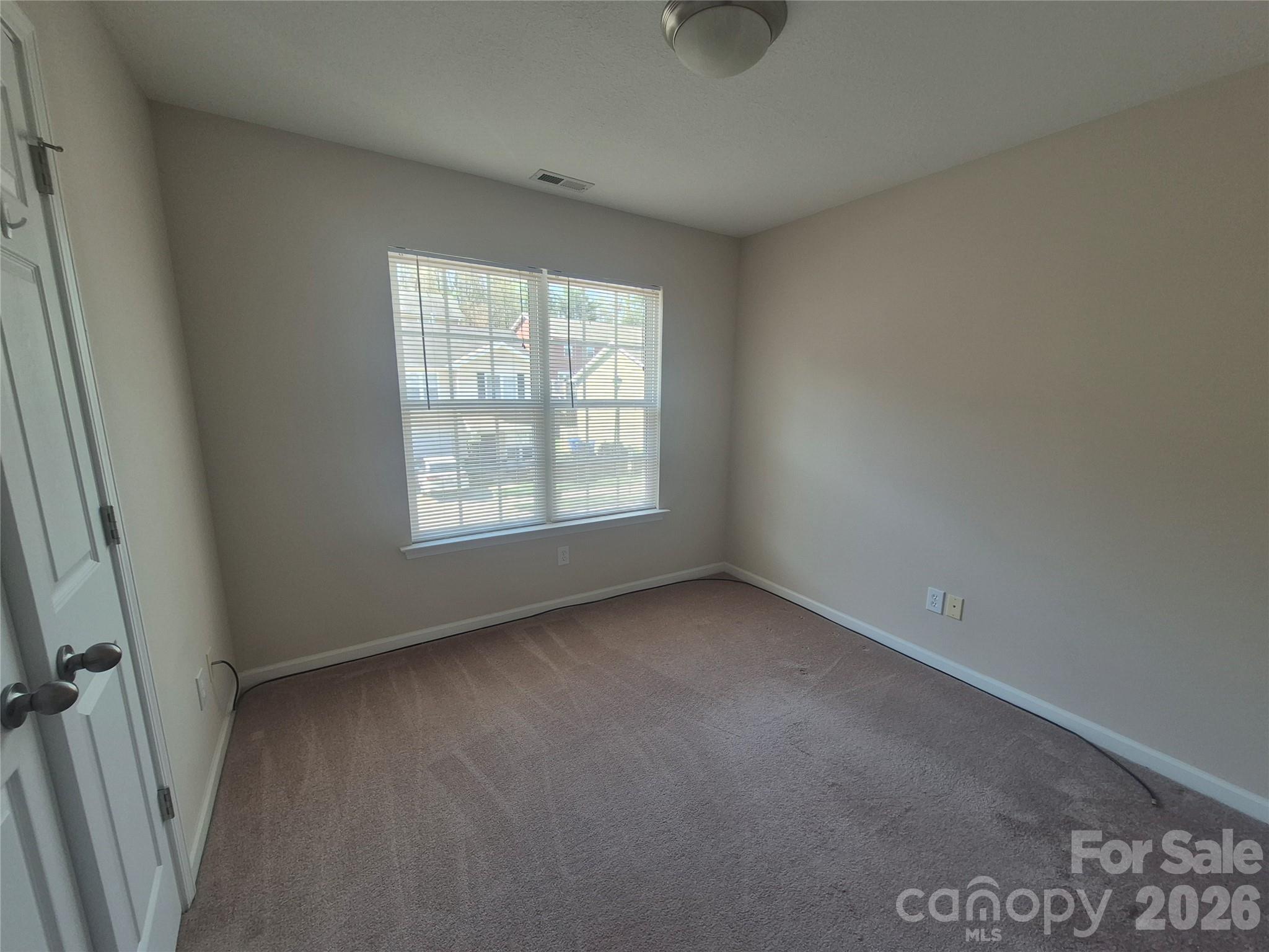 149 Alpine Ridge Drive Asheville, NC 28803 - Photo 14 of 15 an empty room with a window