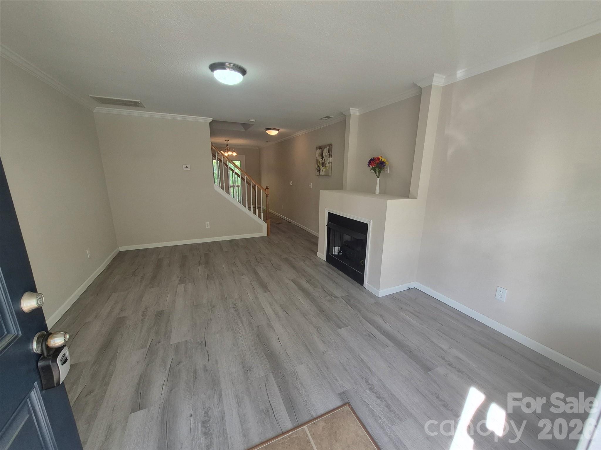 149 Alpine Ridge Drive Asheville, NC 28803 - Photo 5 of 15 wooden floor in an empty room with a window