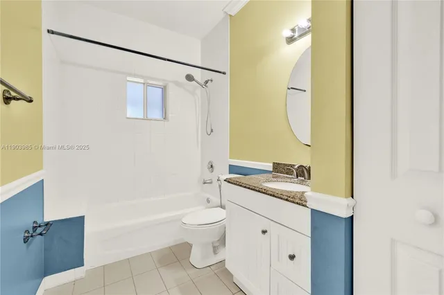 a view of a swimming pool with a backyard and palm trees