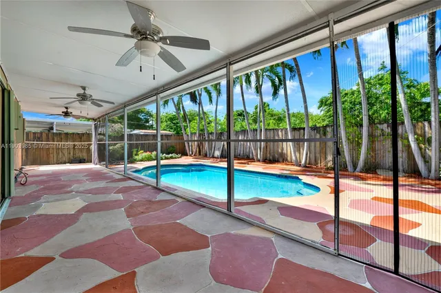 a view of balcony with wooden floor and fence