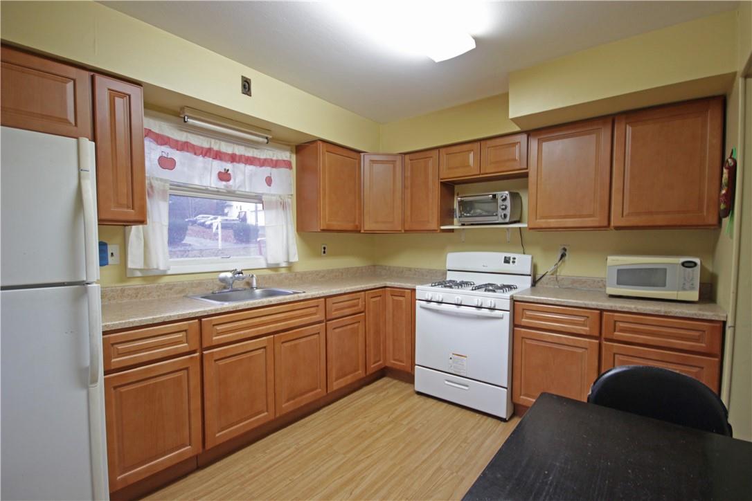 34 Midway Road Spring Valley, NY 10977 - Photo 1 of 1 a kitchen with stainless steel appliances granite countertop a sink stove and refrigerator