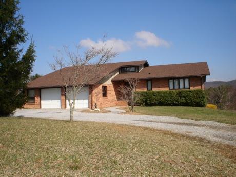 2410 Huffville Road Pilot, VA 24138 - Photo 1 of 1 a front view of a house with a yard