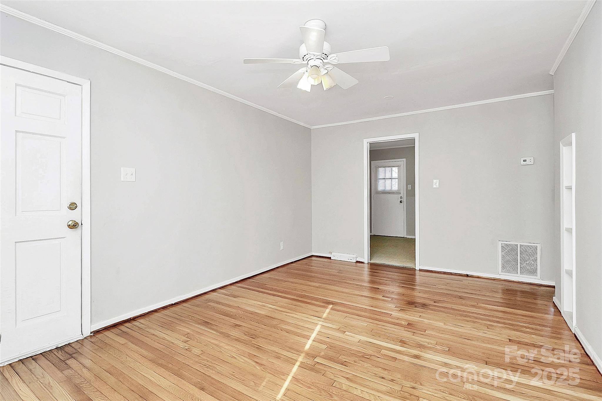 3210 Minnesota Road Charlotte, NC 28208 - Photo 13 of 20 a view of an empty room with wooden floor