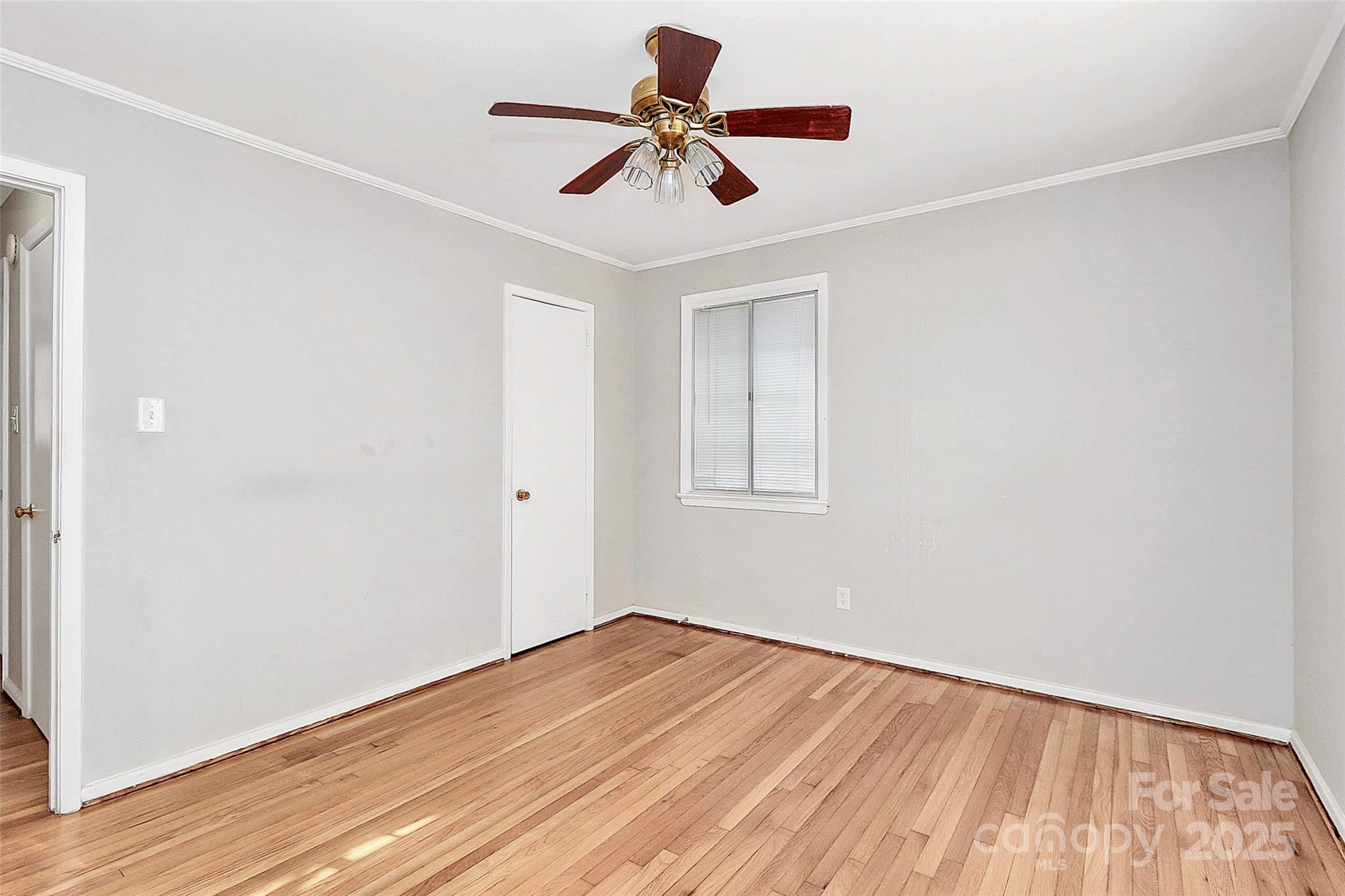 3210 Minnesota Road Charlotte, NC 28208 - Photo 14 of 20 a view of room with window ceiling fan and wooden floor