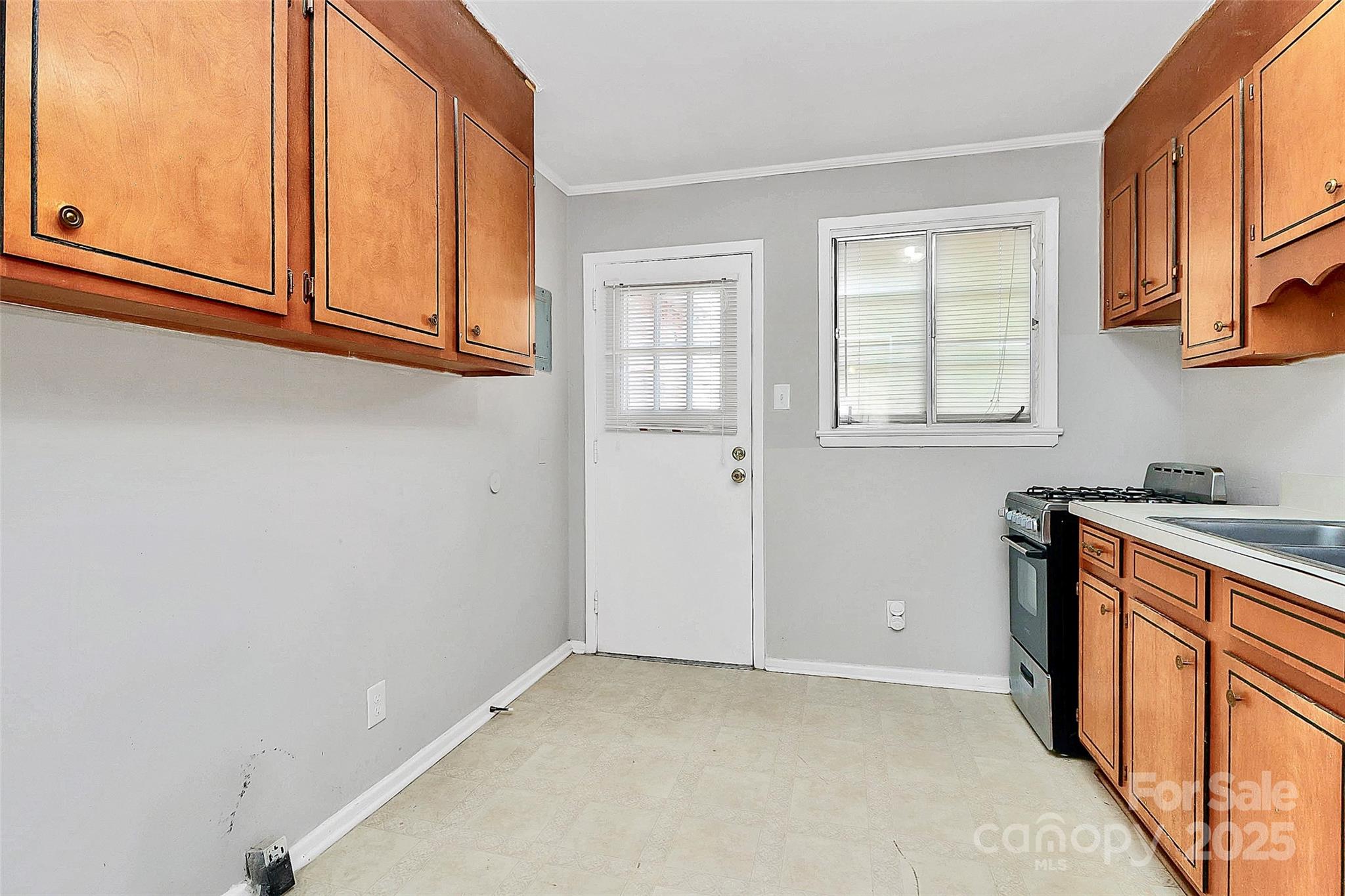 3210 Minnesota Road Charlotte, NC 28208 - Photo 19 of 20 a view of a kitchen with stainless steel appliances granite countertop a refrigerator and a sink