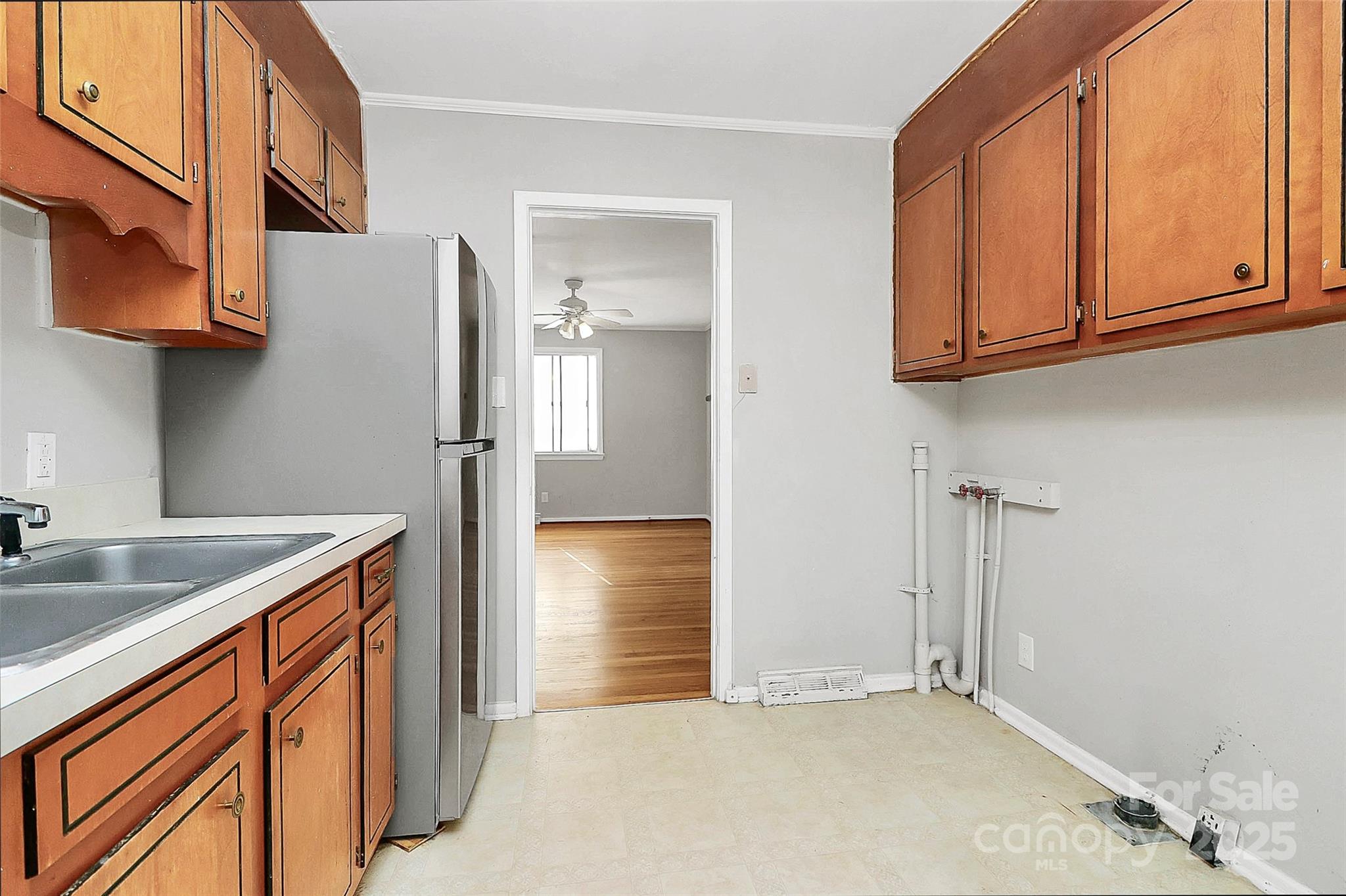 3210 Minnesota Road Charlotte, NC 28208 - Photo 4 of 20 a kitchen with stainless steel appliances granite countertop a refrigerator and a sink