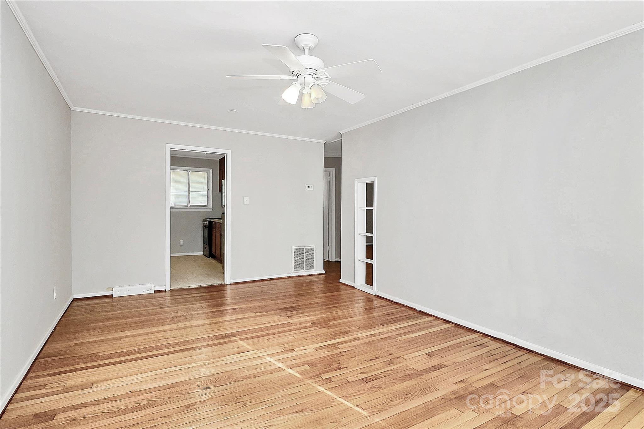 3210 Minnesota Road Charlotte, NC 28208 - Photo 5 of 20 a view of an empty room with wooden floor