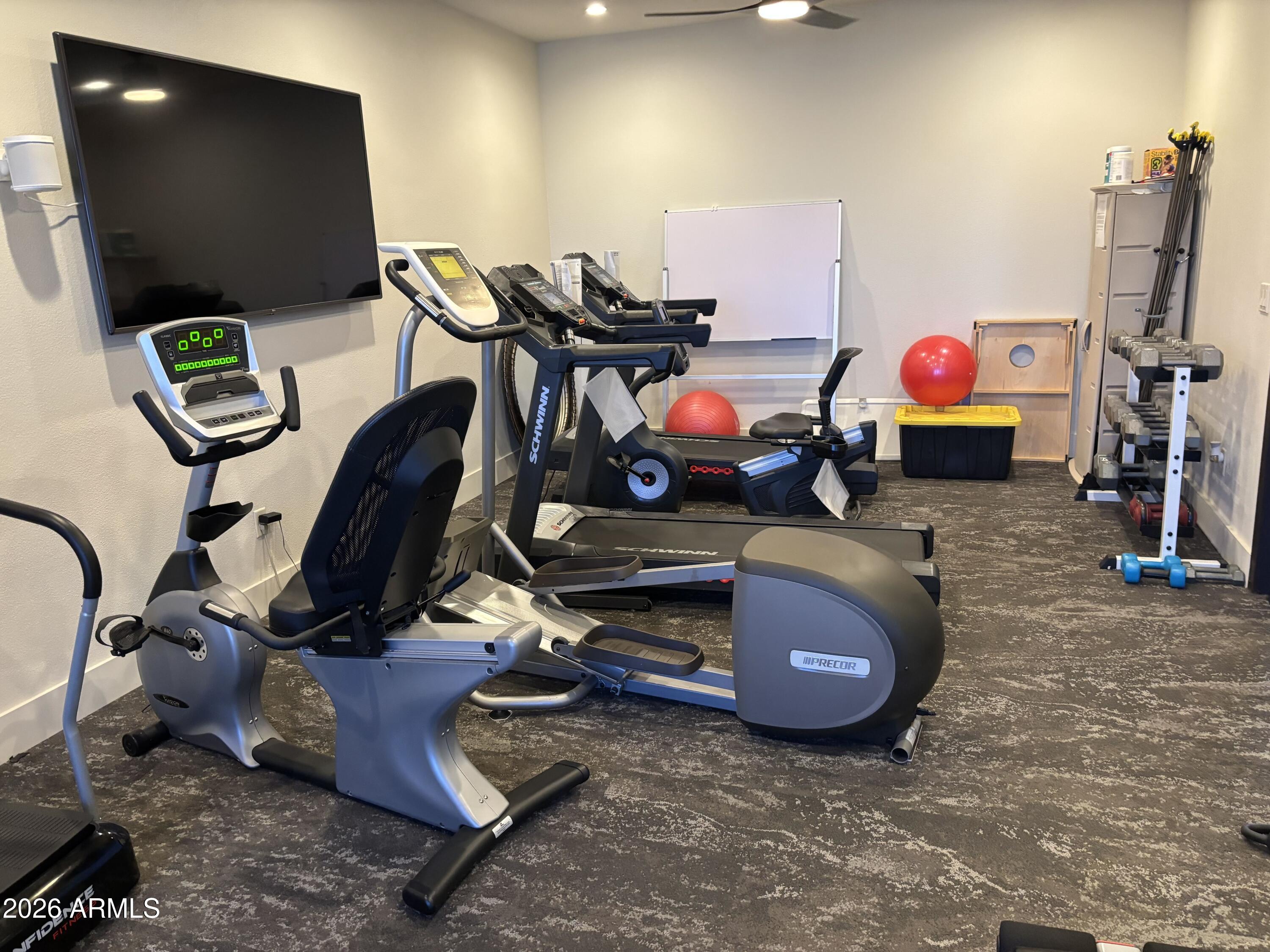 16101 North El Mirage Road, Unit 327 El Mirage, AZ 85335 - Photo 5 of 19 a room with furniture and air hockey table
