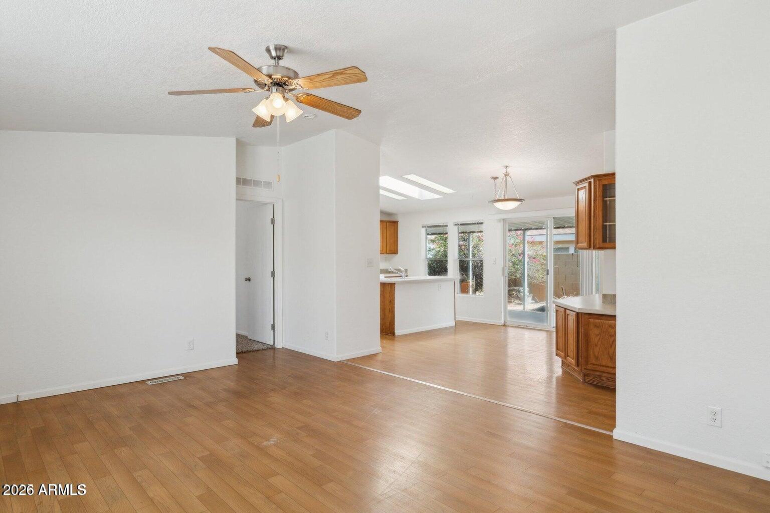 16101 North El Mirage Road, Unit 327 El Mirage, AZ 85335 - Photo 7 of 19 a view of a livingroom with a kitchen