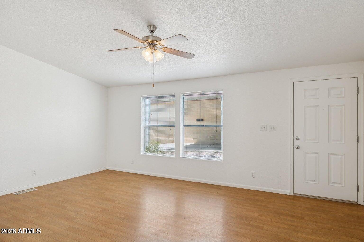 16101 North El Mirage Road, Unit 327 El Mirage, AZ 85335 - Photo 10 of 19 a view of an empty room with a window