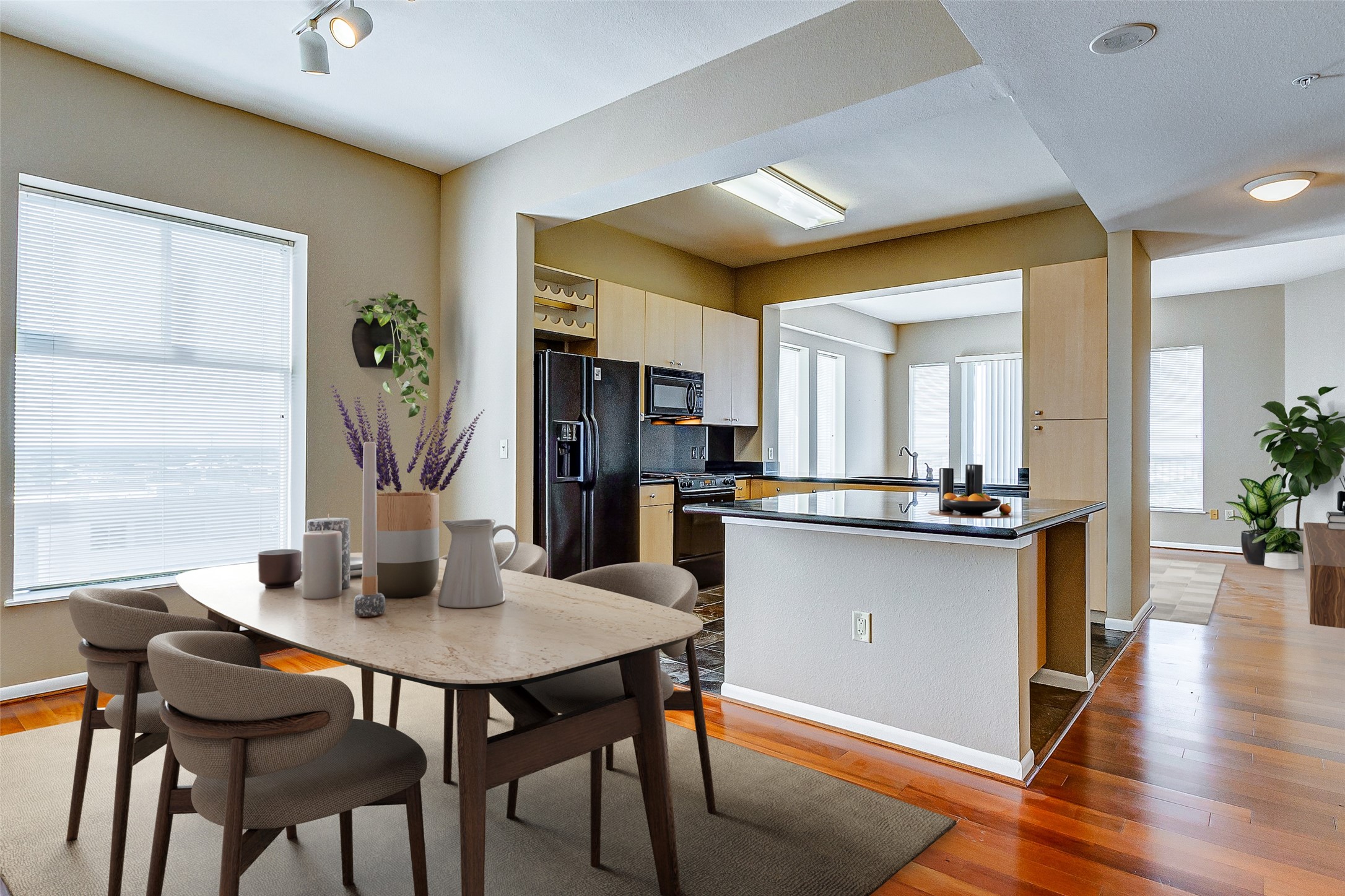 a dining room with furniture and wooden floor