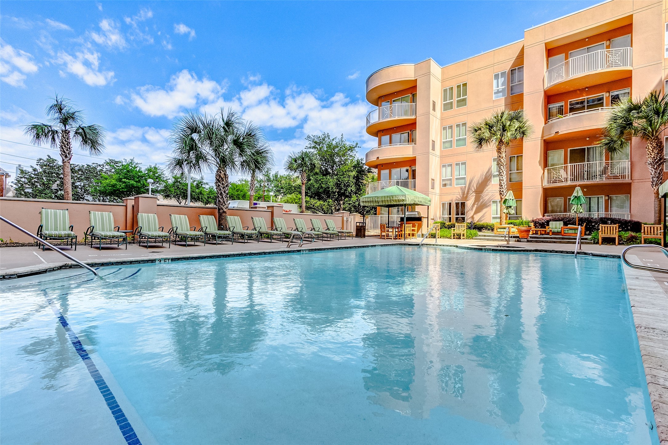3505 Sage Road, Unit 1702 Houston, TX 77056 - Photo 2 of 23 a view of a swimming pool with outdoor seating