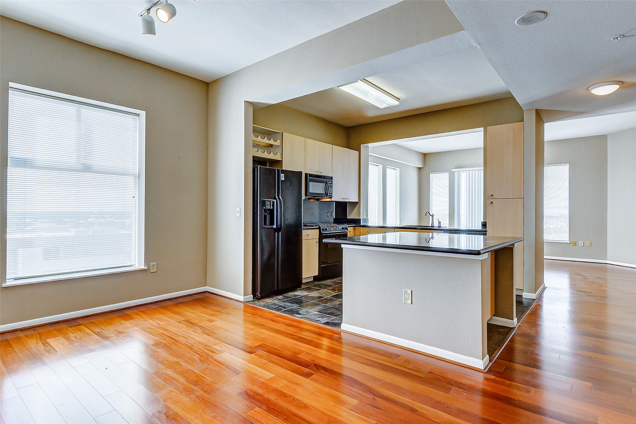 3505 Sage Road, Unit 1702 Houston, TX 77056 - Photo 21 of 23 a view of a kitchen with wooden floor and a kitchen