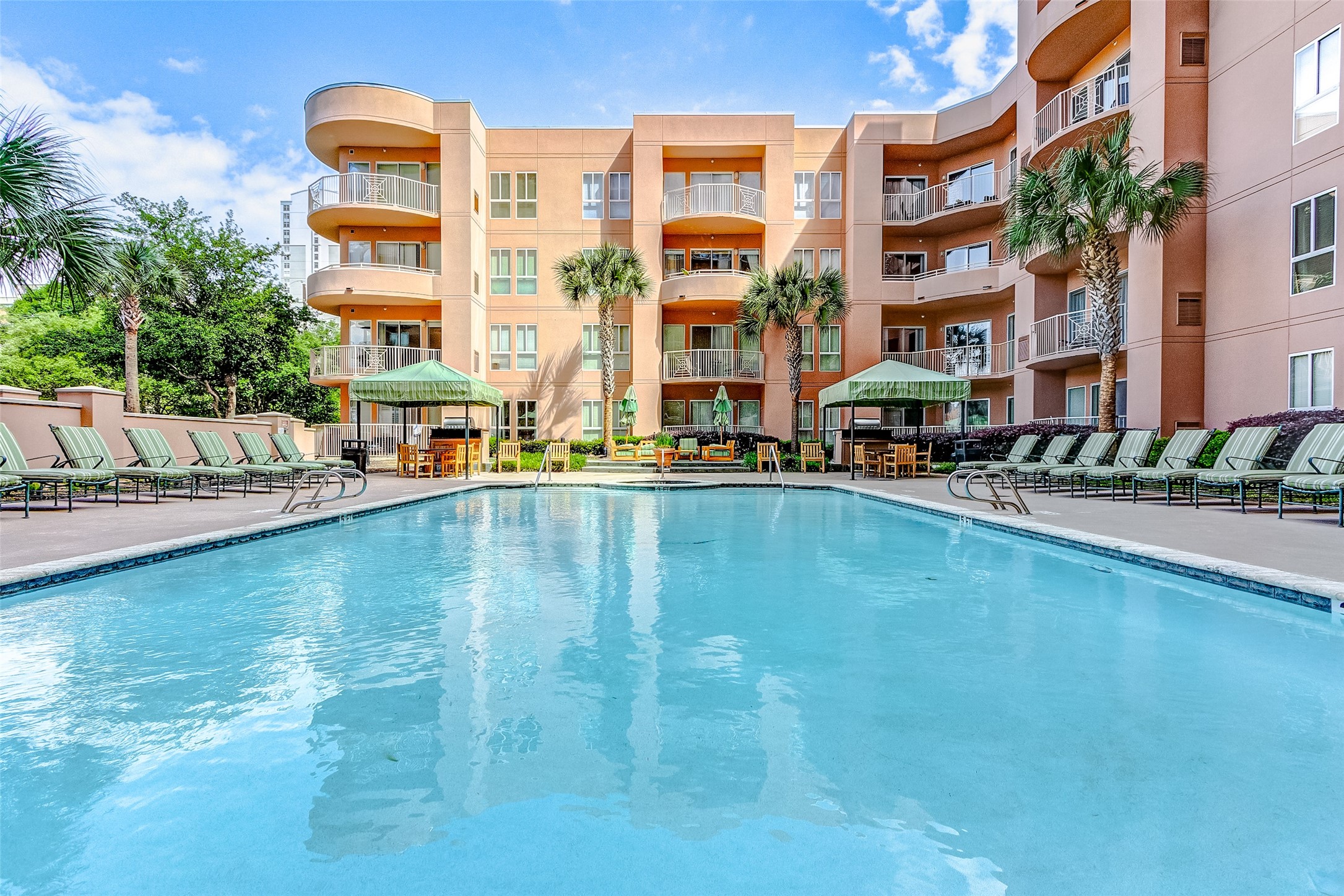 3505 Sage Road, Unit 1702 Houston, TX 77056 - Photo 3 of 23 a swimming pool with outdoor seating and yard