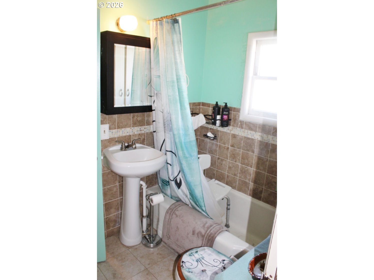 212 Concord Street Helix, OR 97835 - Photo 12 of 22 a bathroom with a sink a toilet and mirror
