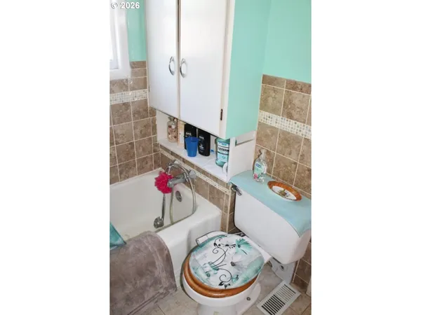 a picture of a room with a table and chairs