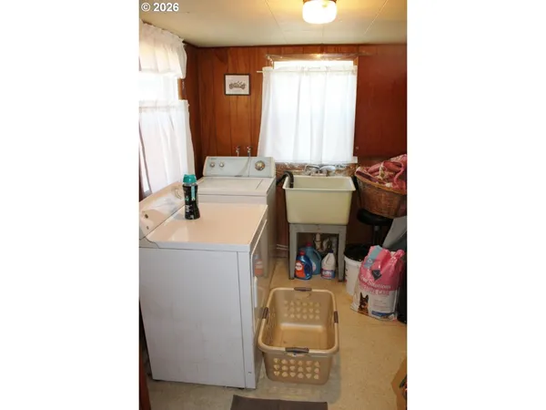 a bathroom with a sink toilet and mirror