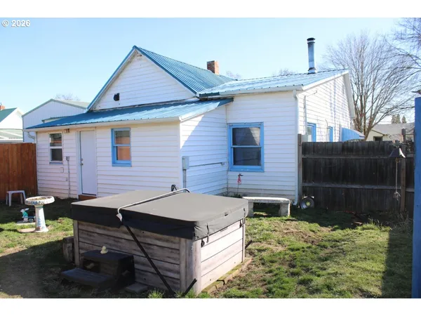 a aerial view of a house with table and chairs