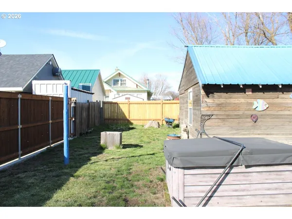 a living room with a bed and a table