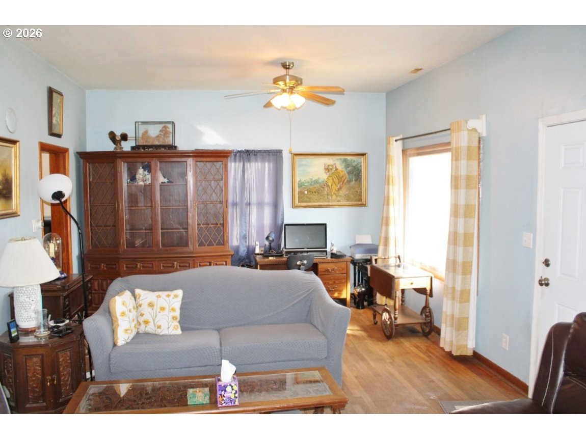 212 Concord Street Helix, OR 97835 - Photo 5 of 22 a living room with furniture and a chandelier