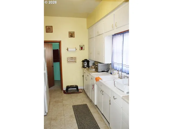 a bathroom with a sink a mirror and a shower